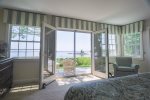 Master bedroom features french doors out onto the deck